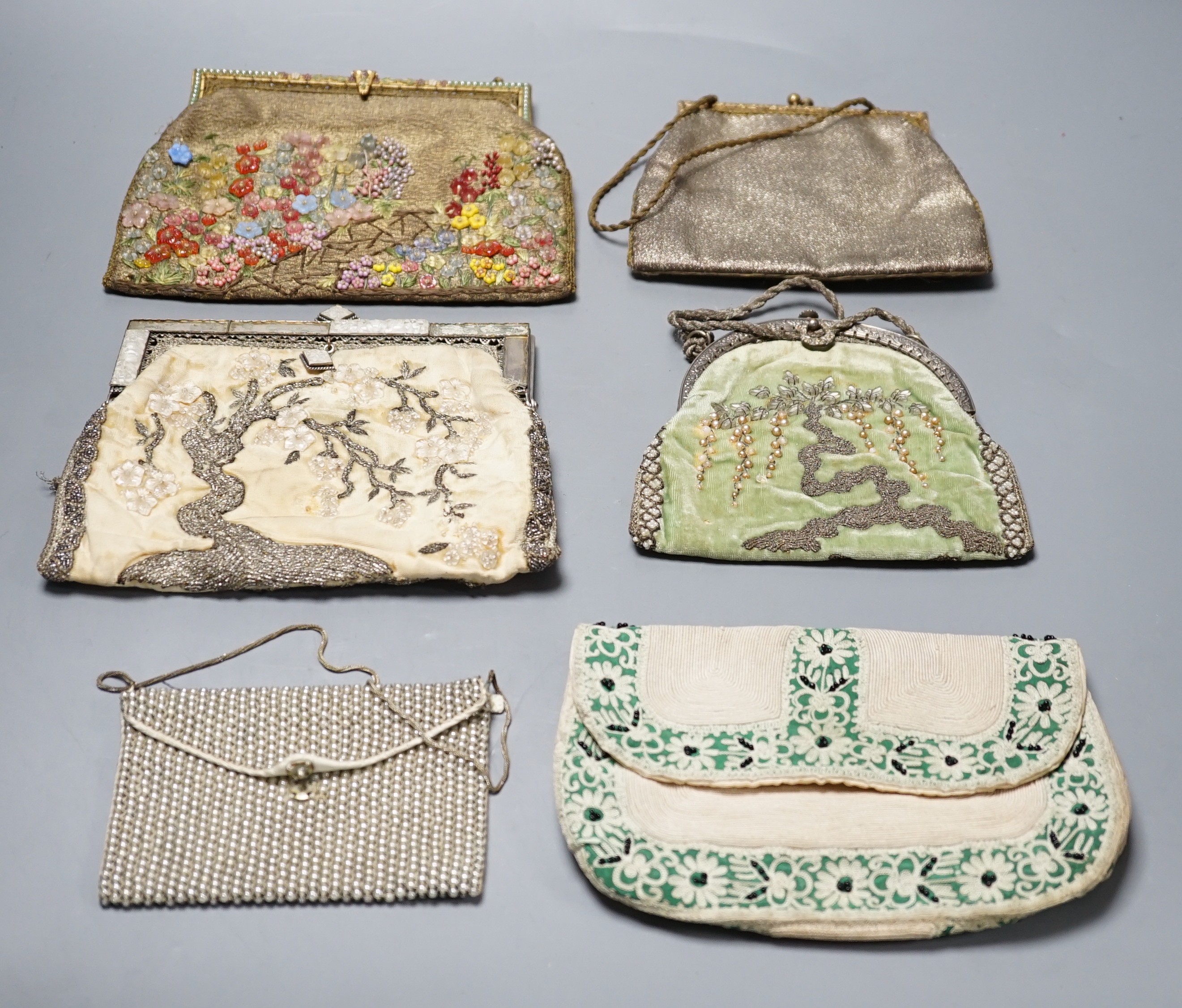 Four hand made evening bags with applice designs, a chain stitch clutch bag and a small bead work purse, largest 16 cms high